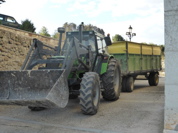 ESPECIALLY FOR GARNER AND EMMITT... a big digger hauling a load of potatoes (Note - a New Holland product - see them everywhere here)