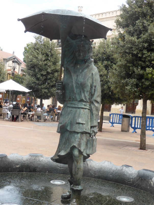 Hard to see, one of so many fanciful statues about town - this one a fountain with water falling  off the umbrella