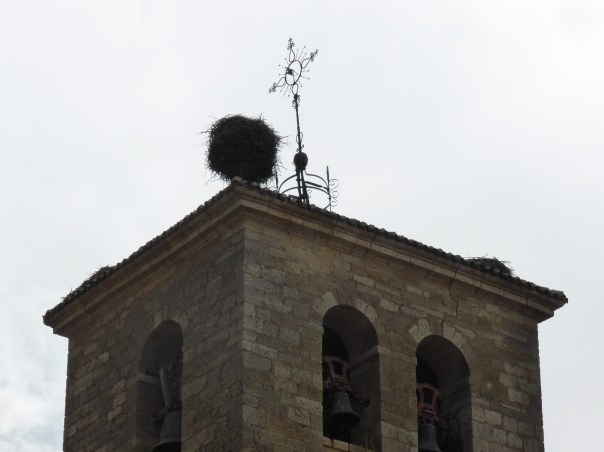 That's a stork's nest on the top of our  destination church.  Look at the size!