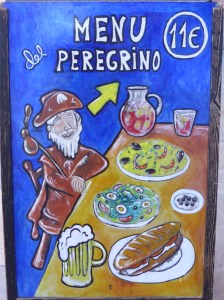 All along the Camino there are inexpensive "Pilgrims Meals"  - a soup, a meat dish, some vegitables, desert and a bottle of wine for 9 - 11 Euros (about $15)