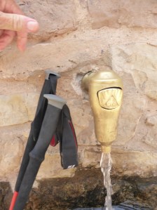 a Camino water tap... Rods poles beside. The poles are an absolute must. Makes for much easier climbing and safer descents. Thank you Heather!