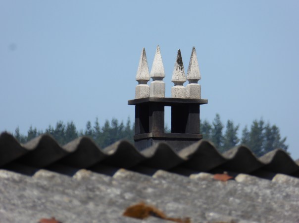 The symbols places on the top of chimneys to ward off evil spirits. 