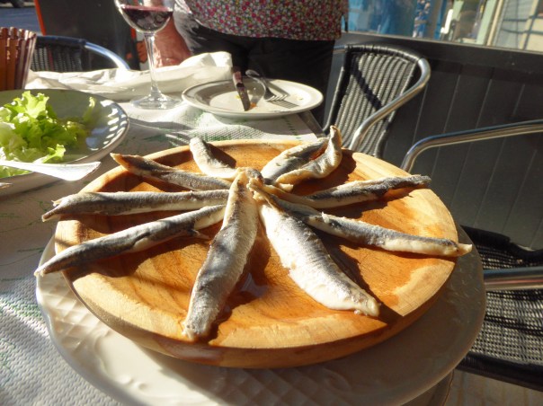 Hmmmm... On the menu it said anchovies.  Those are the biggest anchovies I have ever seen and that's not olive oil, it's vinegar!