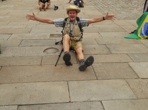 The next series of pictures, hopefully in the order I want them to be! Tell the story of the joy and agony at the finish.  Yes, some who completed the Camino were excited.  Here I am at the Camino shell symbol in the very middle of the square in front of the Cathedral. 